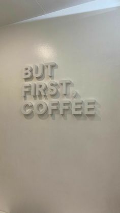 there is a sign that says but first coffee on the wall