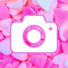 a camera surrounded by pink and blue hearts