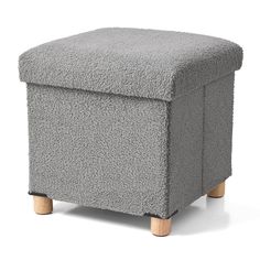 a small grey ottoman with wooden legs on a white background, it is also used as a footstool