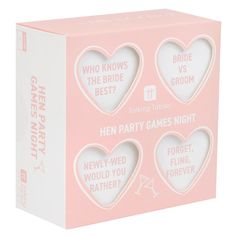 a pink box with three game pieces in the shape of hearts