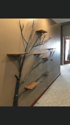 an empty hallway with metal branches on the wall