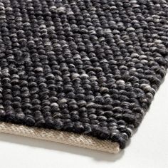 a close up view of a black and white rug