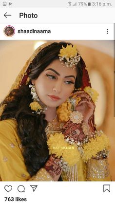 a woman wearing a yellow outfit and holding flowers in her hair with the caption photo shaddhanana