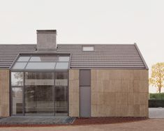 a small house with a large glass door