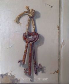 an old key is hanging on the wall