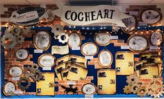 a display with many different types of clocks and pictures on the wall above them is an advertisement for cogheart