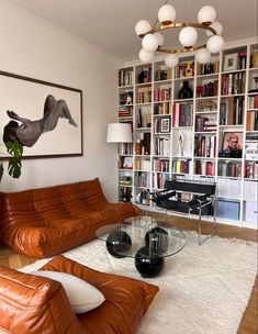 a living room filled with furniture and bookshelves