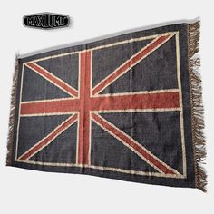 an old british flag hanging on the wall