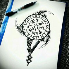 a drawing of a clock on top of a piece of paper next to a pen