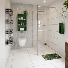 a white tiled bathroom with green accents and shelving above the toilet, along with a towel rack