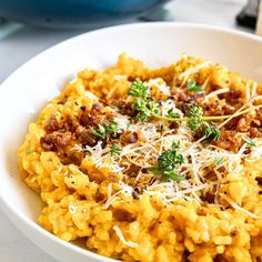 a white bowl filled with macaroni and cheese