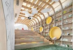 the interior of a store with wooden shelves and yellow plates on it's walls