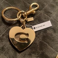 Coach Signature Coated Canvas And Metal Attached Split Key Ring And Dogleash Clip 13/4" (L) Dust Bag Included. Questions? Leave A Comment Below! Keychain Essentials, Mirror Keychain, Number Jewelry, Heart Keyring, Heart And Key, Pink Plastic