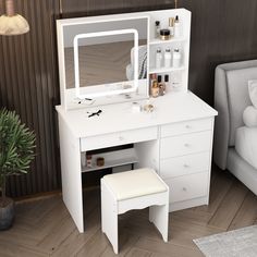 a white desk with a mirror, stool and shelf next to a bed in a room