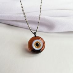 Evil Eye Necklace, Brown Evil Eye Pendant, Nazar Necklace, Glass Evil Eye Jewelry, Protection Necklace, Round Nazar Charm, Evil Eye For Gift Evil eye protection is an ancient belief that helps to protect its owner from jealous eyes. It brings good luck. Also some cultures believe that evil eye necklace brings good health. I hope wearing this jewelry helps your stress, struggles in your daily life <3 All of the glass evil eyes have their own shape, they are handmade and unique like people. It is Brown Glass Necklace For Gift, Art Nouveau Pendant, Protection Necklace, Evil Eye Pendant, Evil Eye Necklace, Eye Necklace, Evil Eye Jewelry, Eye Jewelry, Star Necklace