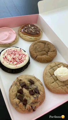 a box filled with different types of cookies