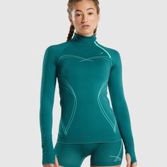 Gymshark Seamless Long Sleeve Workout Gym Top Teal Green Size L Brand New, Never Worn, With Tag And Original Packaging Slim Fit Triangular Mesh Knit Design Ribbed Cuffs Size Large Tags: Workout, Sports, Athletic, Athleisure, Gym Compression Shirts Women, Compression Shirts, Long Sleeve Workout Top, Knit Structure, Functional Fitness, Hiit Training, Gymshark Women, Long Sleeve Workout, Zip Design