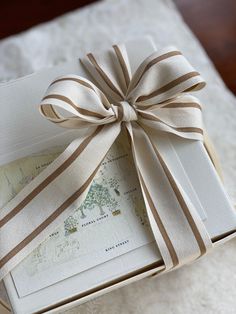 an open box with a ribbon tied around it