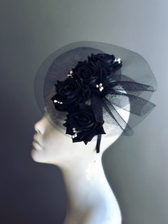 This all-black headpiece features elegant black roses set against a fine black mesh. Perfect for adding a touch of sophistication to any special occasion Age Group/Gender - Adult/Women Size/Type - One size fits all adults Color - black Special Features - Black roses and white buds Elegant Black Party Veil, Fitted Black Headpiece For Races, Fitted Black Headpiece For Evening, Elegant Halloween Fascinator, Black Event Headband, Black Fitted Fascinator For Events, Fitted Black Fascinator For Events, Elegant Black Halloween Mini Hats, Elegant Black Mini Hat For Halloween