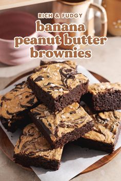 chocolate brownies with peanut butter frosting on a plate