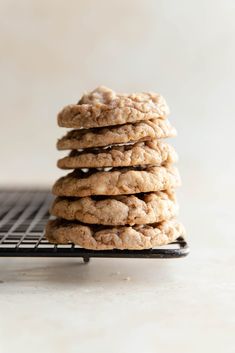 a stack of cookies sitting on top of a cooling rack