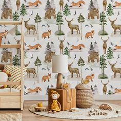 a child's room with deer wallpaper and toys on the floor in front of it