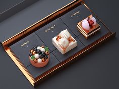 three different desserts are on display in a gold tray with black and white tiles