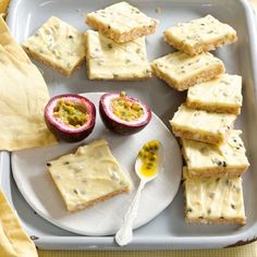 there is a tray with crackers and fruit on it