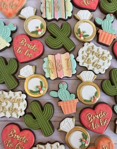 decorated cookies in the shape of cactuses and succulents are on display