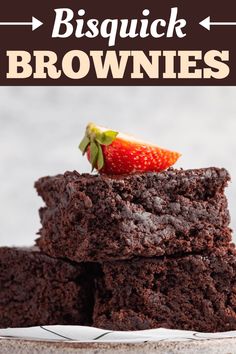 chocolate brownies stacked on top of each other with a strawberry on top and text overlay