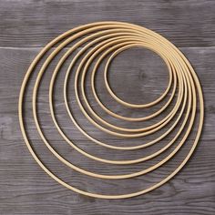 a set of six wooden circles on top of a wooden table