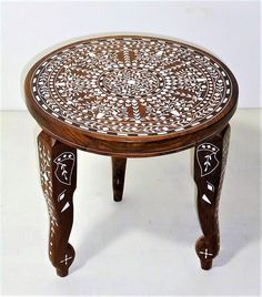 a wooden table with an intricate design on it