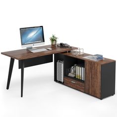 an office desk with a computer on it and bookshelf underneath the desk top