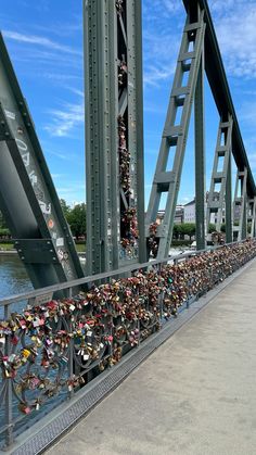 many padlocks are attached to the bridge