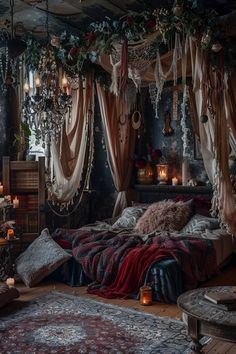 a bed with lots of pillows and blankets on it in a room filled with candles