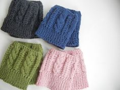 three knitted shorts sitting next to each other on a white surface with the same pattern