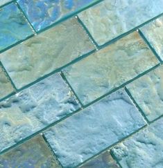 a close up view of some blue and green tiles