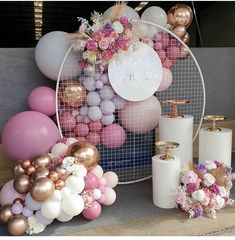 balloons, flowers and candles are arranged on the floor