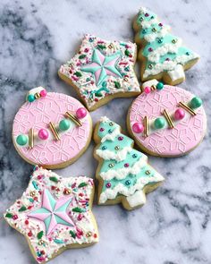 decorated cookies on a marble counter top