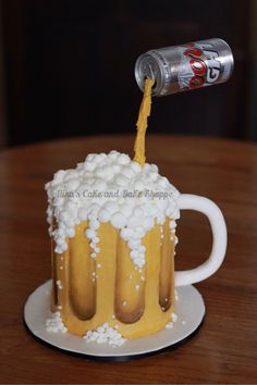 a beer being poured into a mug cake