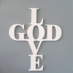 the words i love god are cut out of white paper and placed on a black background