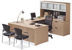 an office desk with two chairs and a computer