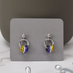 Dainty Pride Earrings in the colors of the Nonbinary Pride flag.💛 aluminum links on stainless steel ear post🖤 extra ear backs included (extras may be different style)💜 Earrings are mirror image since that is what most customers have requested. If you prefer each earring to be the same (yellow on the left for both), just leave a note during checkout and I'll be sure to make your earrings that way. NONBINARY PRIDE colorway: yellow, white, purple, black Bigender Earrings, Acexual Earrings, Omnisexual Earrings, Non Binary Earrings, Nonbinary Jewelry, Nonbinary Earrings, Nonbinary Gifts, Enby Style, Pride Earrings