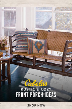 a wooden bench sitting on top of a hard wood floor next to a table and window