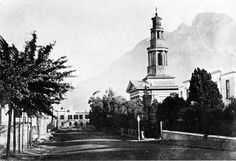 an old black and white photo of a church steeple