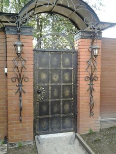 an ornate iron gate is open to the outside