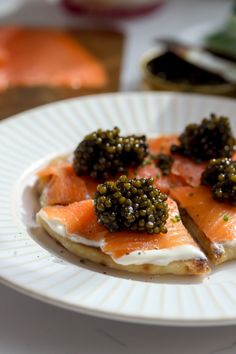 a white plate topped with food on top of a table