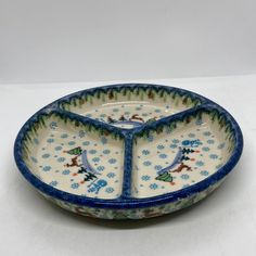 a blue and white bowl with snowmen on it