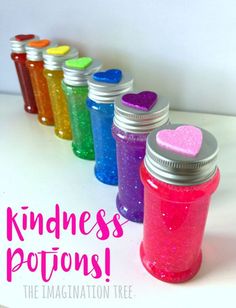 there are many different colored jars with hearts on them and the words kindness is potions