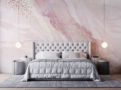 a bedroom with pink marble wallpaper and white bed in front of the headboard